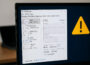 Windows Task-Manager mit hoher CPU-Auslastung und Warnsymbol